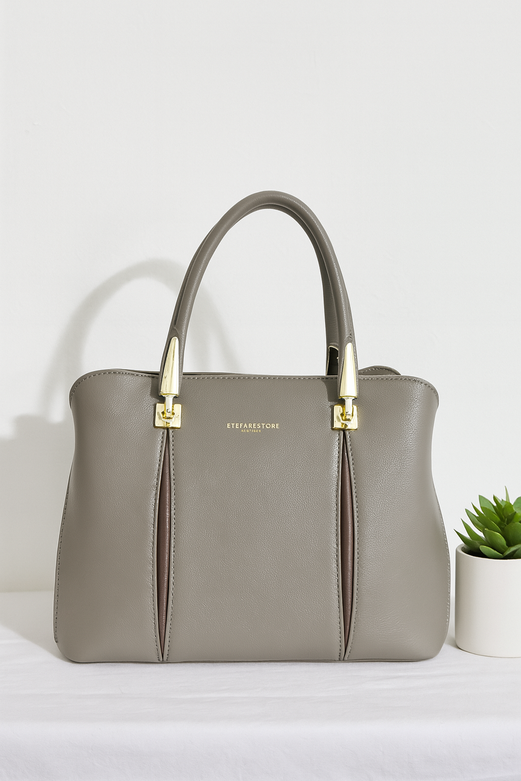 Classic Black Structured Handbag with Gold Detailing – Premium Finish